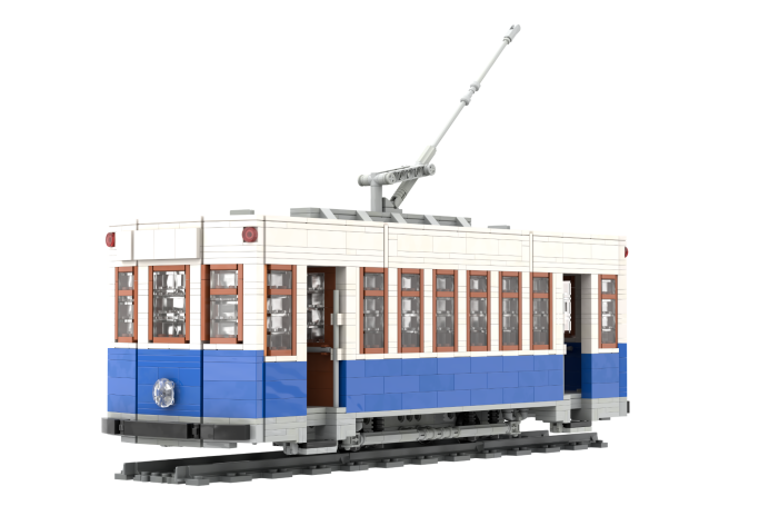 Charleroi II Madrid - I Tram antiguo de juguete en colores blanco, azul y madera, con detalles elaborados.