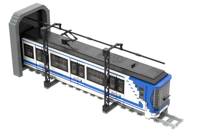 CAF serie 2000 (1 módulo) - II Tren de modelo azul y blanco saliendo de un túnel.