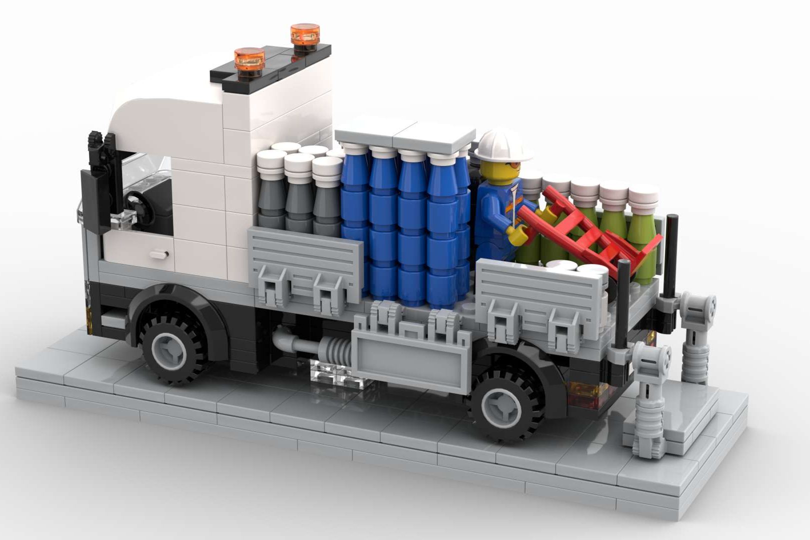 Camión reparto botellas oxígeno MOC Lego Camión de juguete con barriles de colores en la parte trasera y detalles mecánicos.
